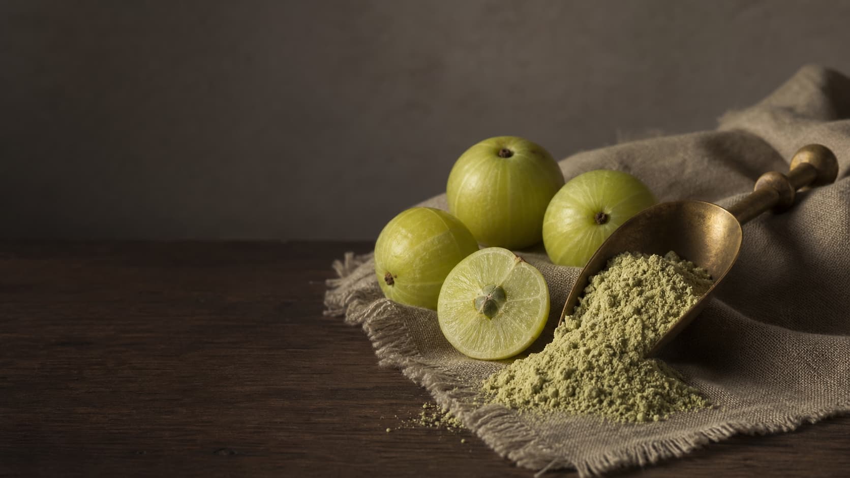 Amla Powder stirred into a glass of warm water